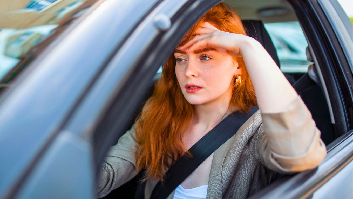 I Left My Husband For A Married Man But He Never Left His Wife frustrated woman sitting in her car with her hand on her forehead