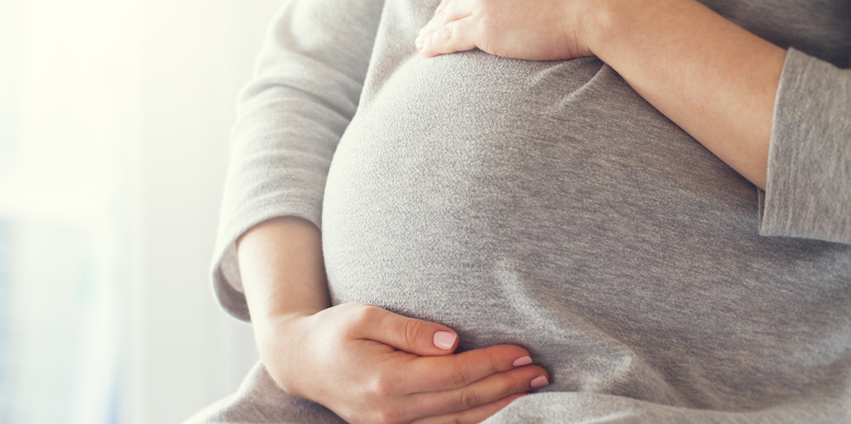 woman holding belly