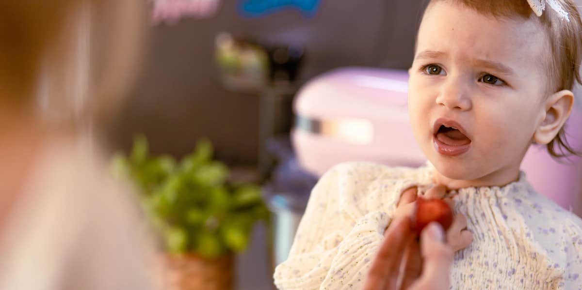 7 Awful Ways Divorced Parents Use Kids As Pawns mom feeding angry baby