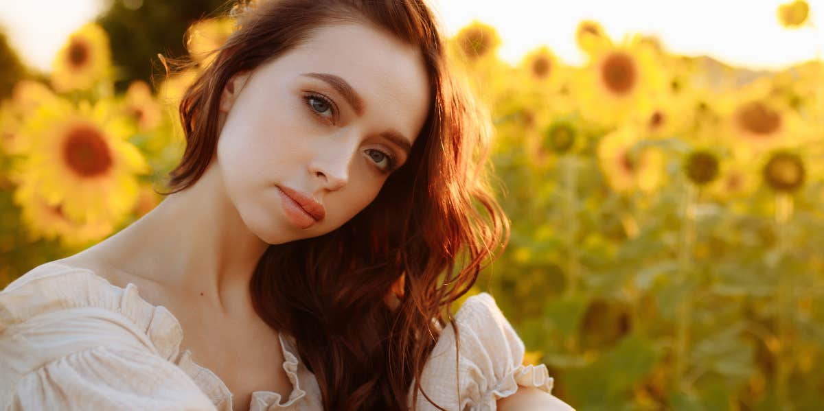 woman in sunflower field 