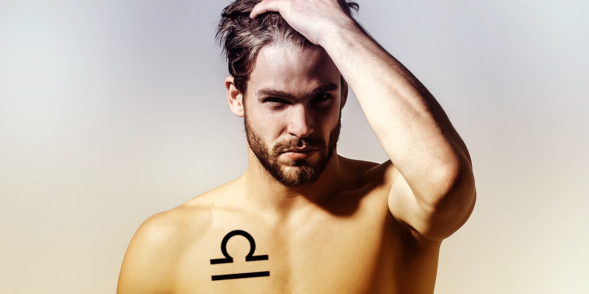 man wearing libra tattoo on chest