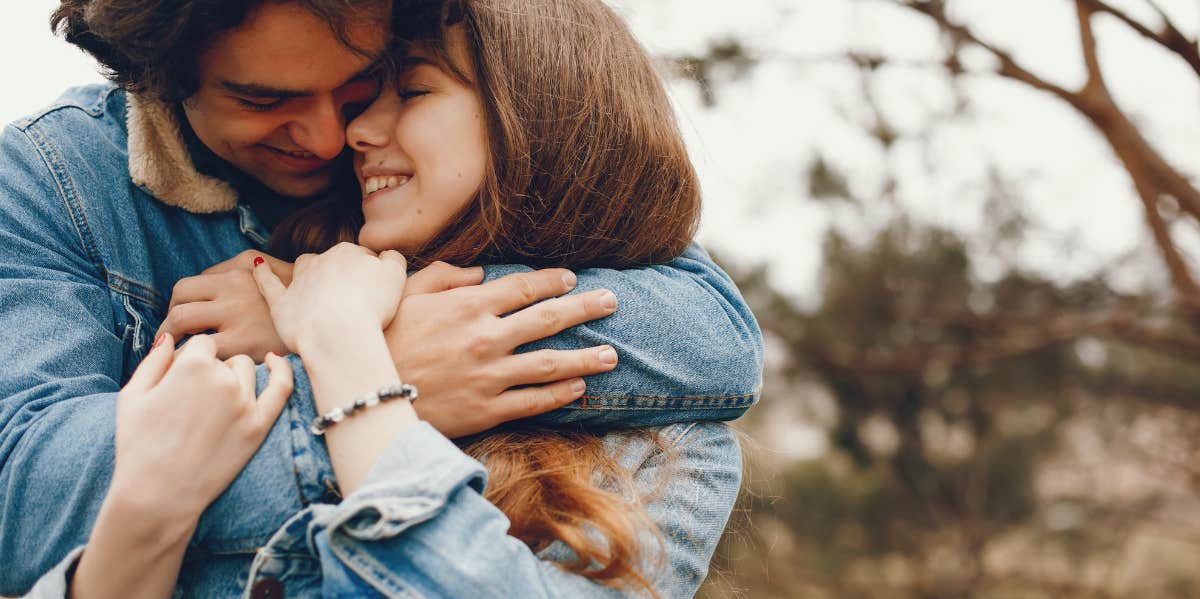 couple snuggling on a fall day