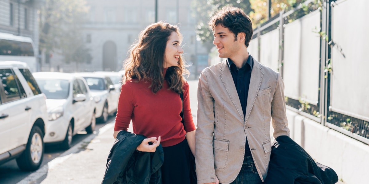 man and woman talking on date