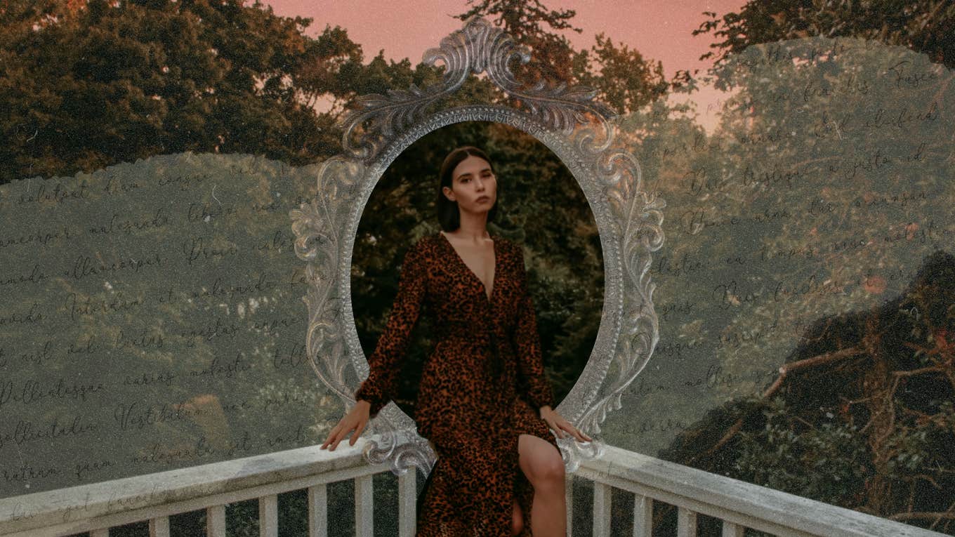 Hopeless romantic in red dress sitting on balcony outside 