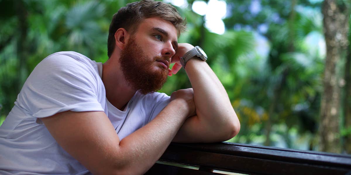 3 Lies You Were Told As A Boy That Crush You As A Man guy sitting alone outside thinking