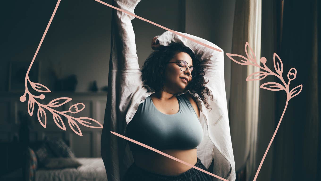 woman stretching joyfully in her room after happily divorcing