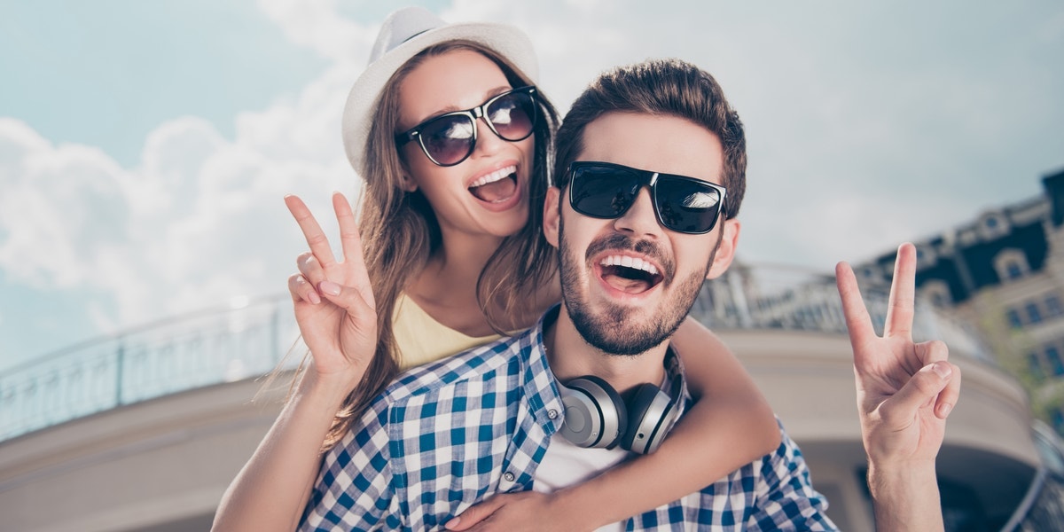 Numerology & Love Compatibility For Master Life Path Number 11 happy couple making peace signs