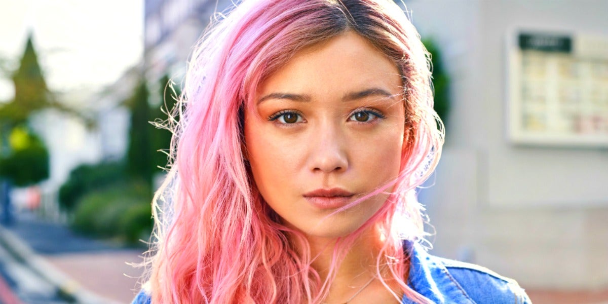 Life Path Master Number 11 Meaning, Per Numerology woman with pink hair