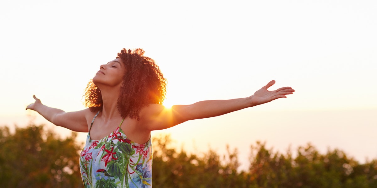 Why The Only Voice You Need To Listen To Is Your Own confident woman with arms stretched out to each side