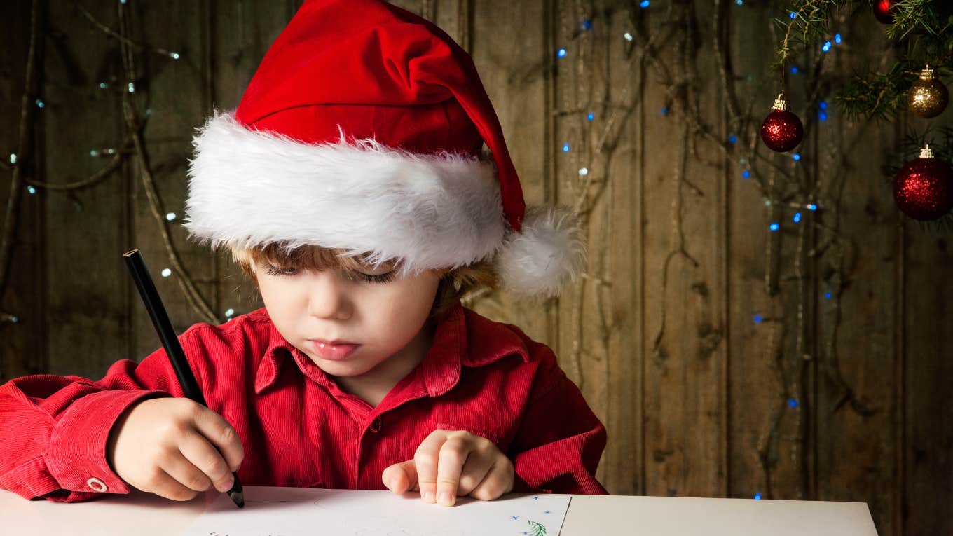 Little Boy With Vision Problems Experiences The Magic Of His First Letter From Santa little boy writing letter to santa
