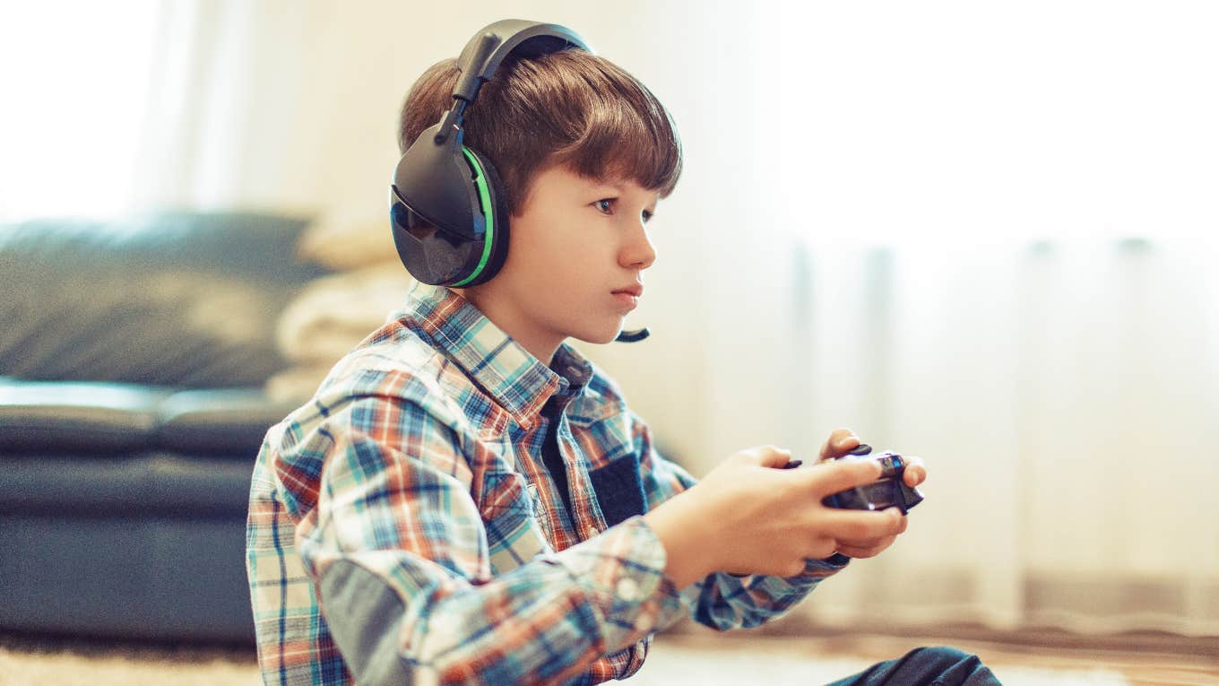 little boy playing a video game