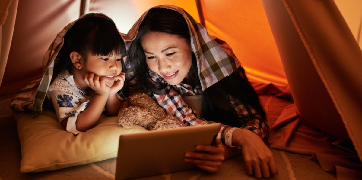 mother and child watching a movie together