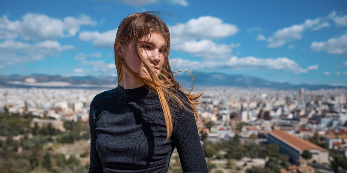 Little Behaviors That Have A Way Bigger Impact Than You Think womans hair blowing in the wind