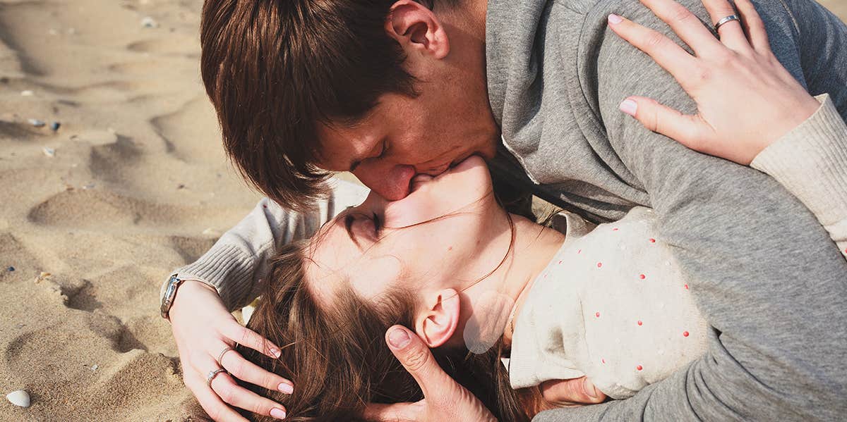 man and woman kissing