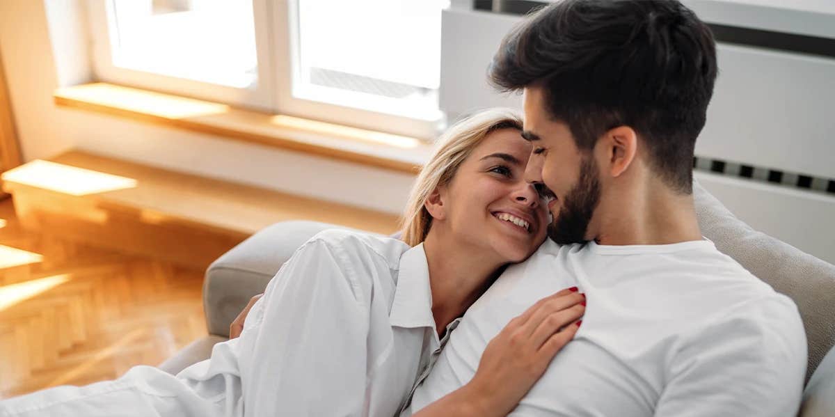 couple smiling on chair