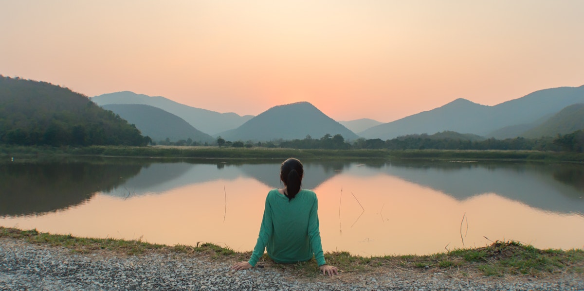 woman looking at a lake