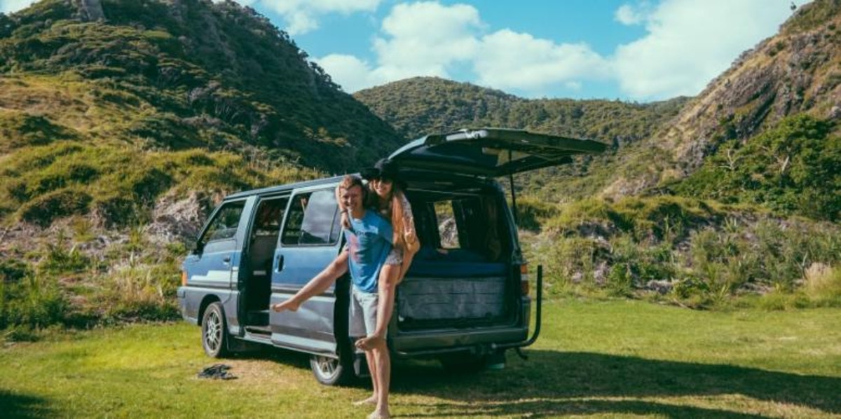 photo of van life with hilly mountains in background