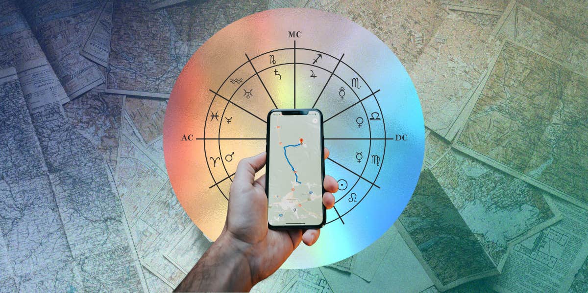 person holding a phone in front of zodiac birth chart wheel