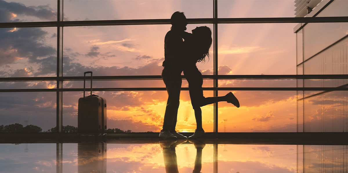 couple hugging in airport