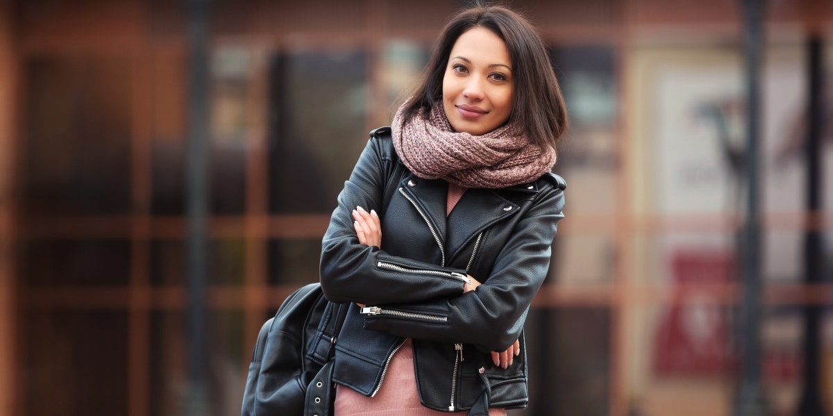 smiling woman wearing leather jacket