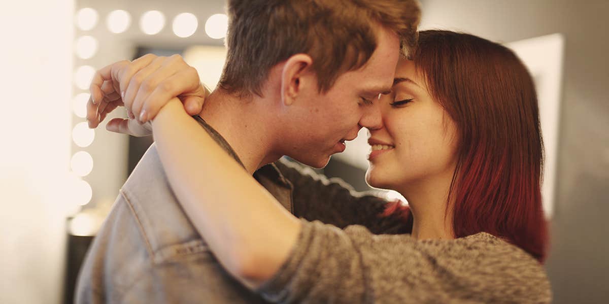 couple, about to kiss at home