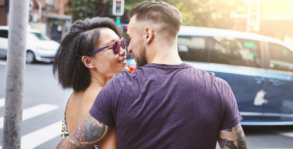 man kissing woman