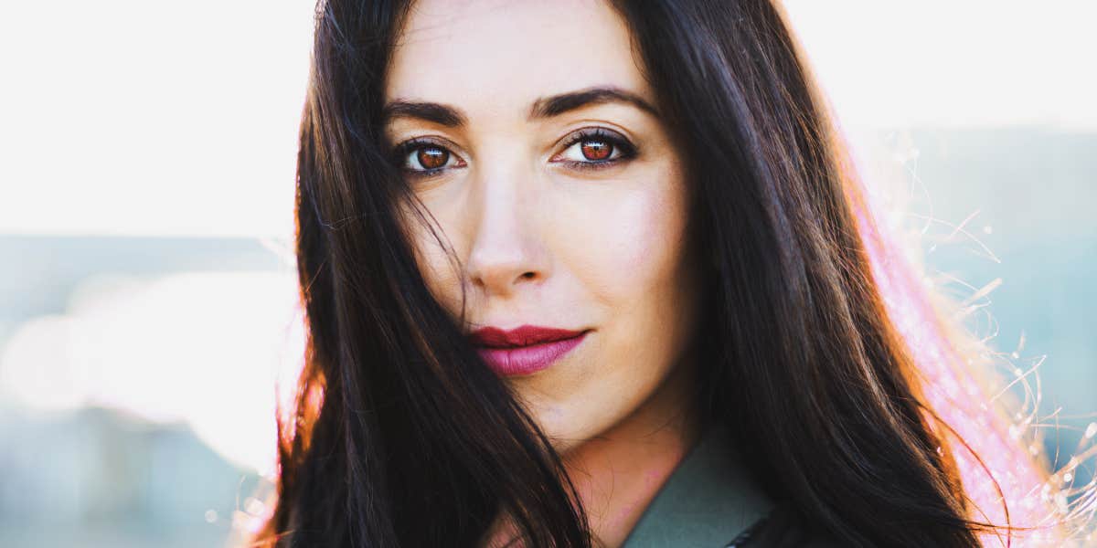 brunette woman looks into camera