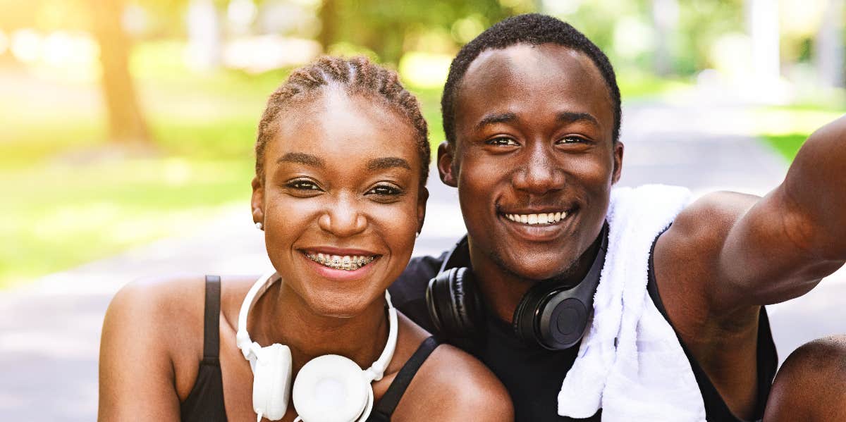 Love and conflict Man and woman smiling after workout together