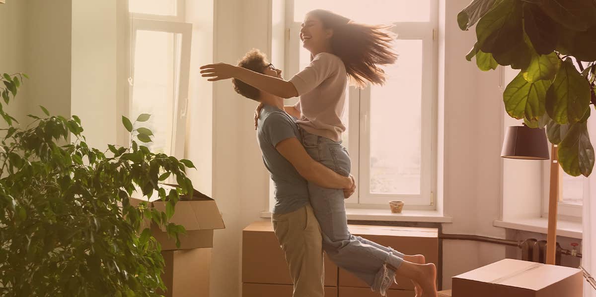 Man lifting woman into the air