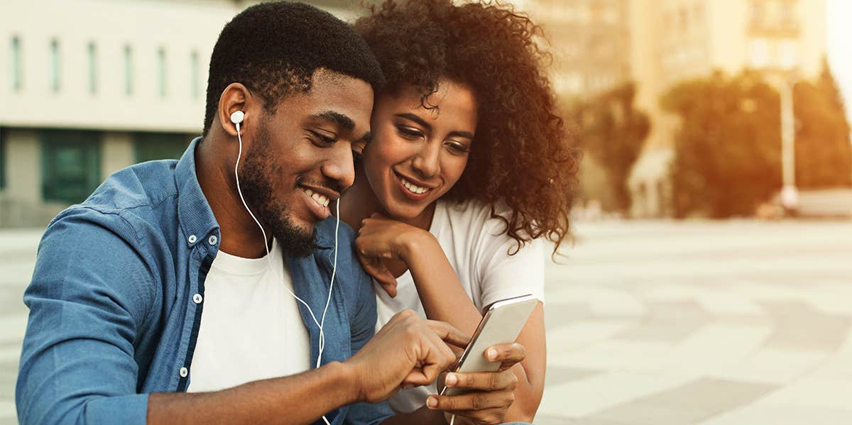 man and woman listening to music