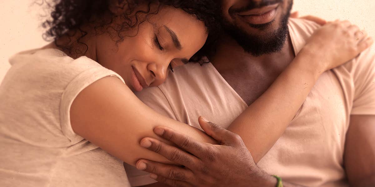 The Critical Difference Between Unconditional Acceptance And Enabling Unhealthy Behavior couple hugging