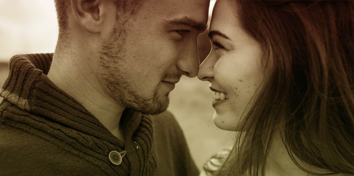 smiling couple embracing close