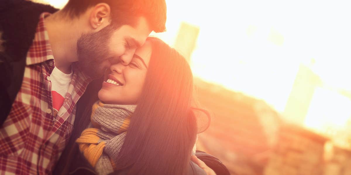 couples embracing in sunset