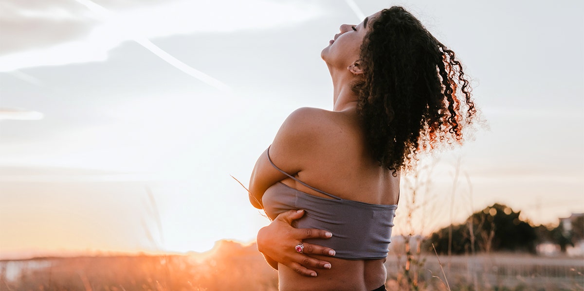 woman hugging herself