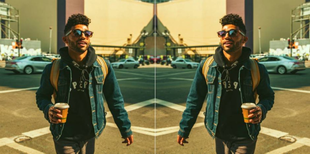 What It Means If A Man Has Low-Hanging Testicles man carrying coffee with sunglasses walking