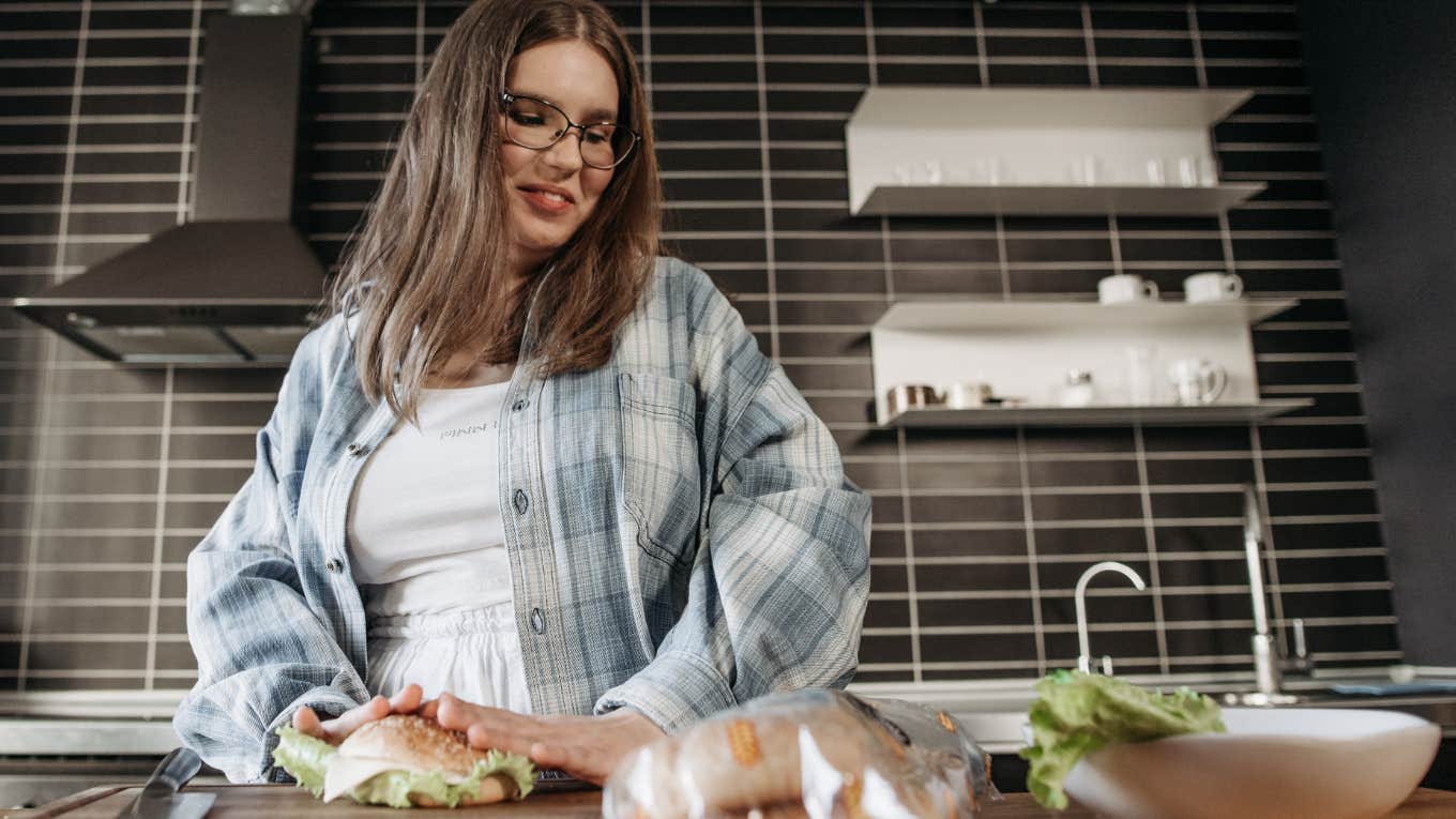 Woman making lunch in her kitchen. 