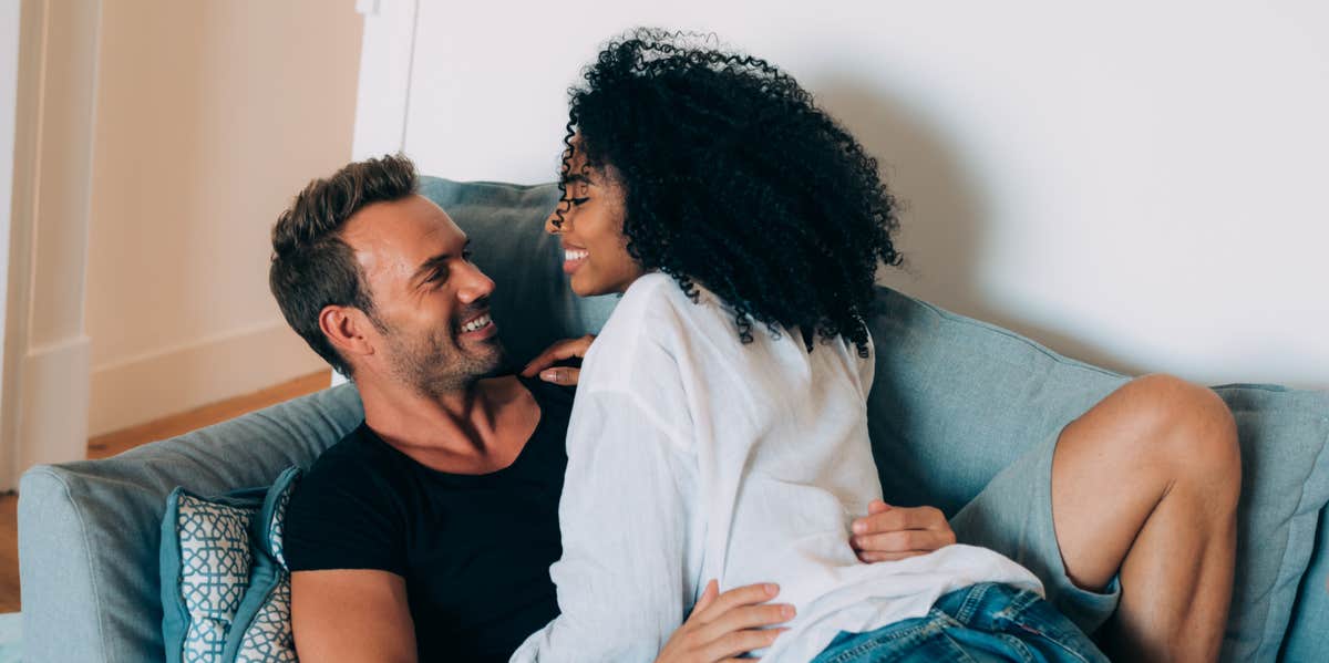 couple kissing on couch