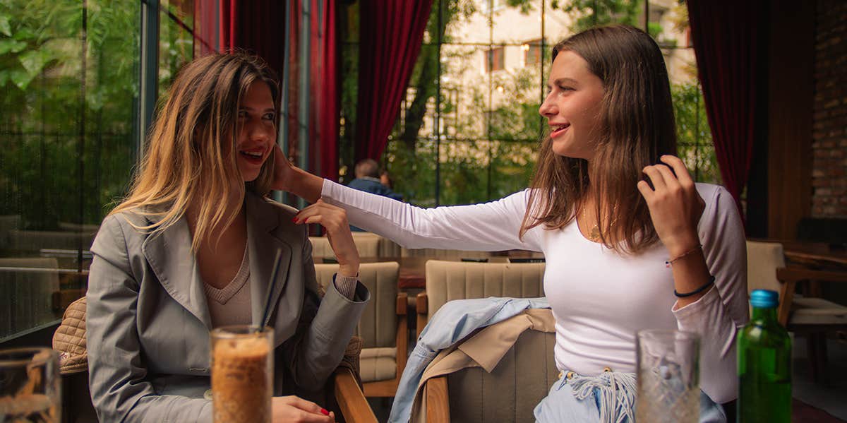 two women having coffee together