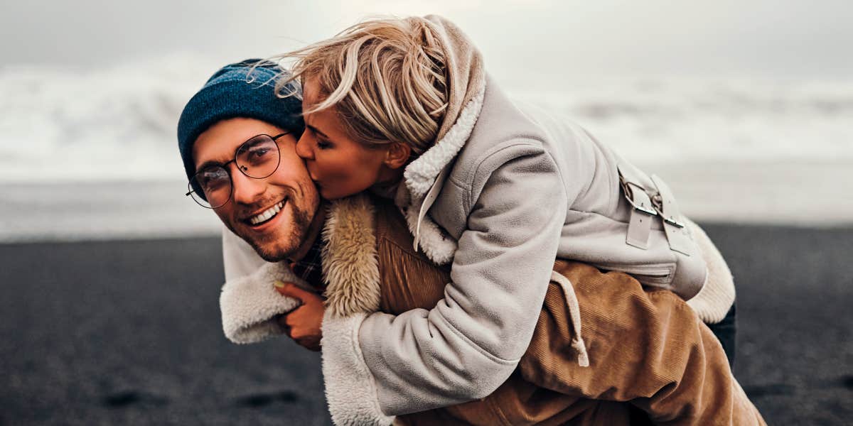 how to make a man feel seen and appreciated woman kissing man on the cheek to show appreciation