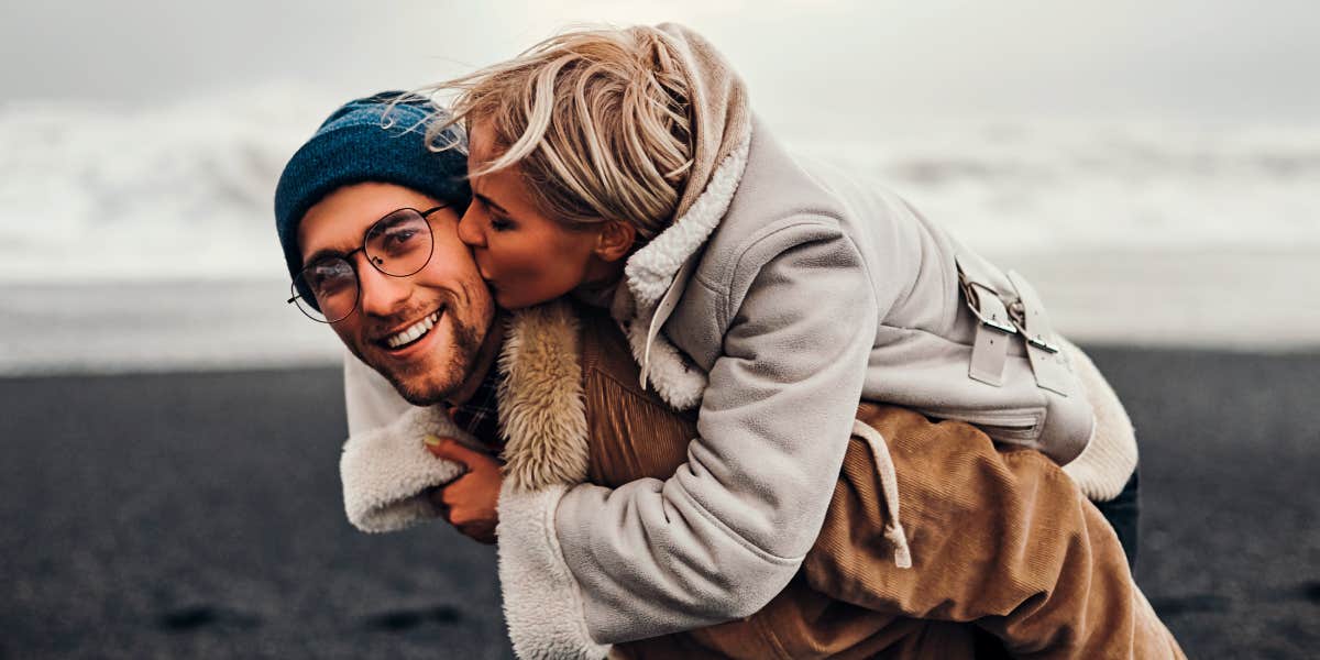 woman kissing man on the cheek to show appreciation