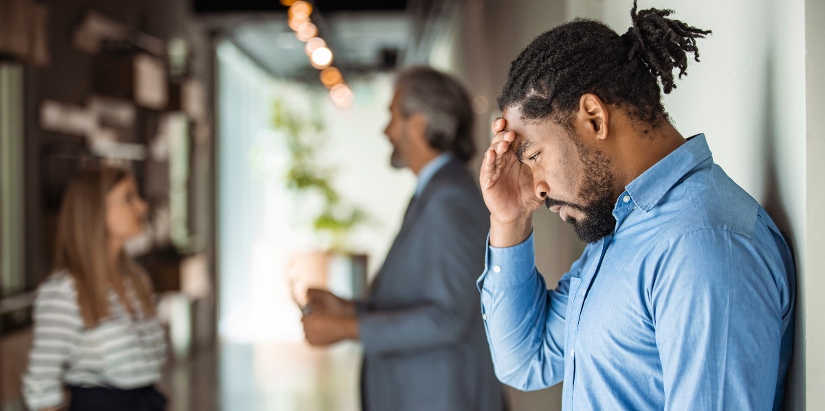 male worker reacting to bad news