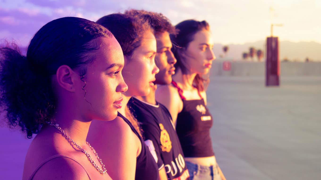 teenagers standing in a line 