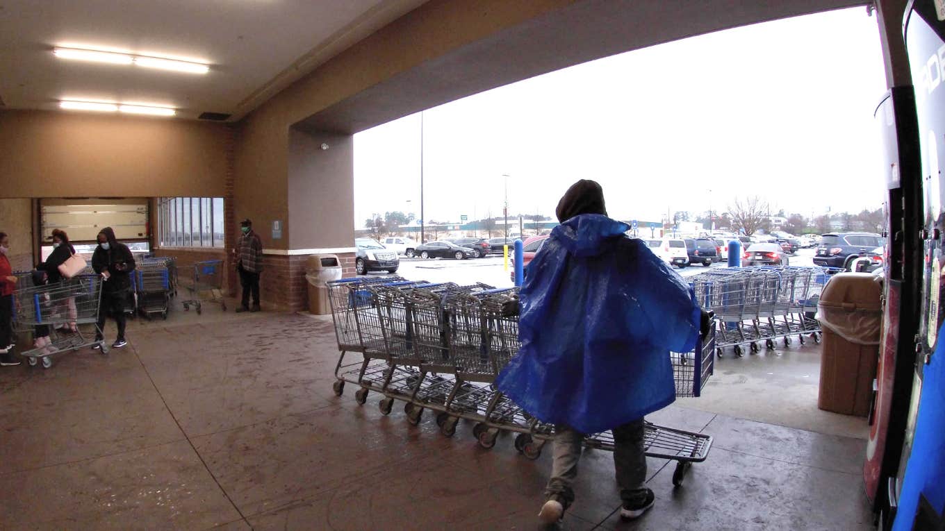 Man Ashamed He Doesn't Want A Career & Likes His Walmart Job man wrangling shopping carts at walmart