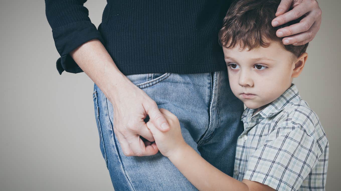 sad son hugging his mother at home.