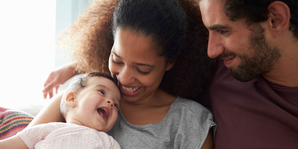 Man Asks Women If They Would Have A 'Negative' Reaction To Their Partner's Asking For Paternity Tests Man and woman with baby