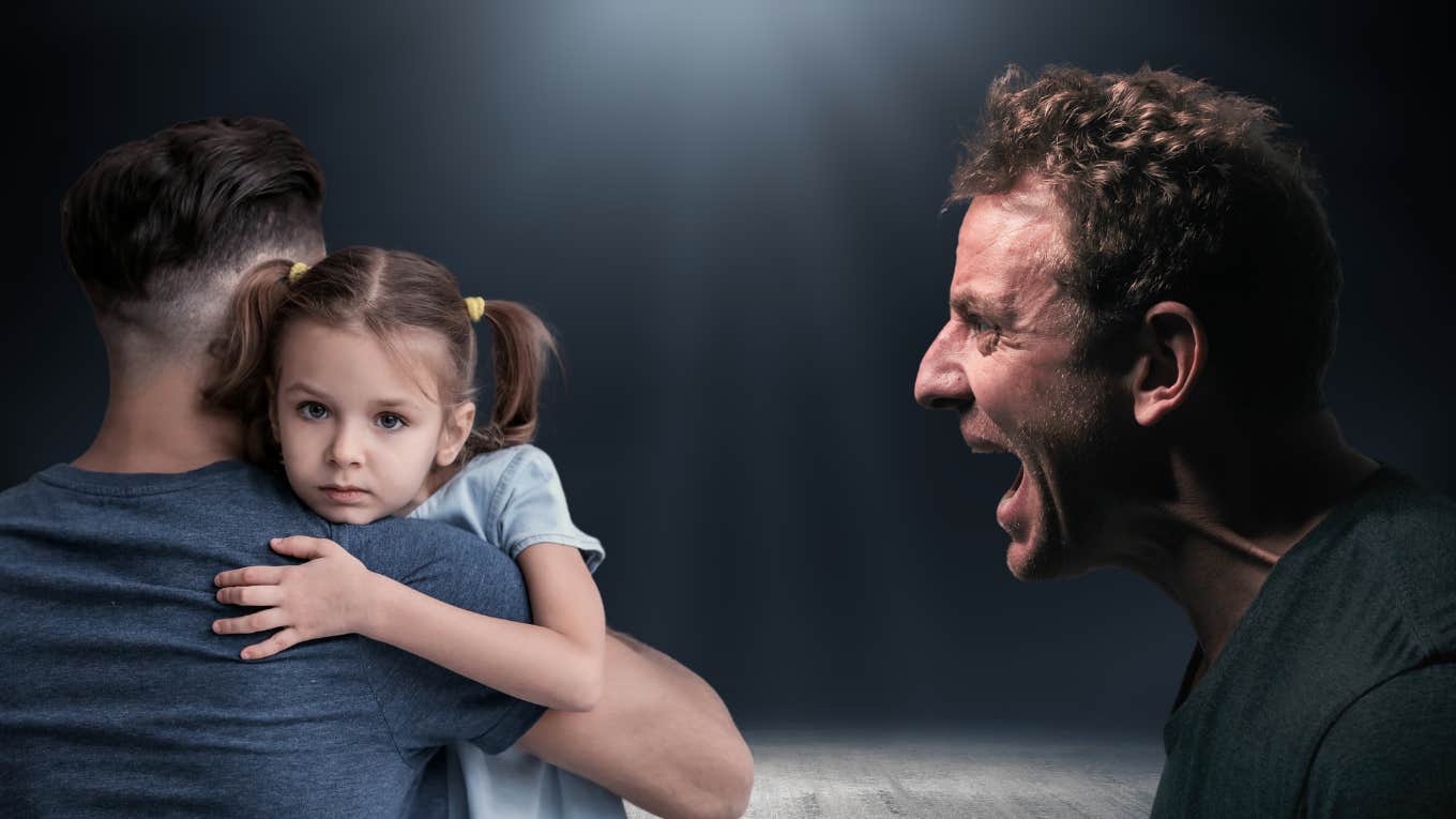 man holding girl, man yelling