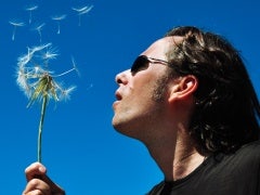 Sex Advice To My Younger Self man with dandelion