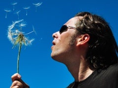 man with dandelion