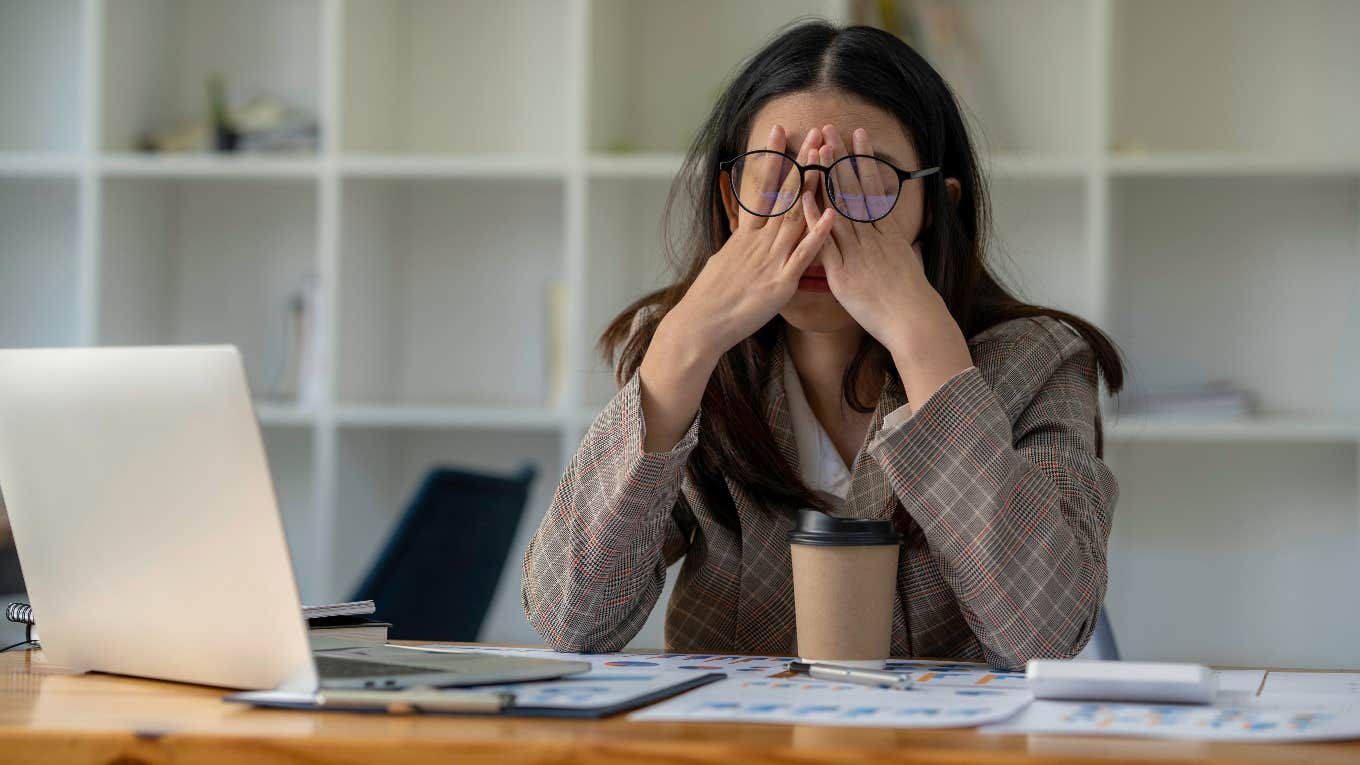 annoyed professional woman working at a desk