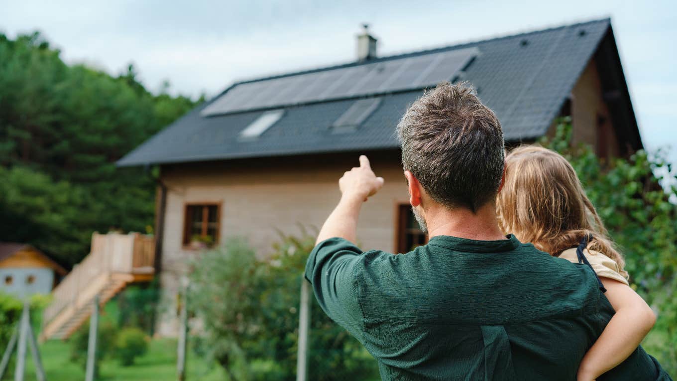 Man Discovers That His Parents' Mortgage Is $287 — His Is 27 Times More Father pointing at a home